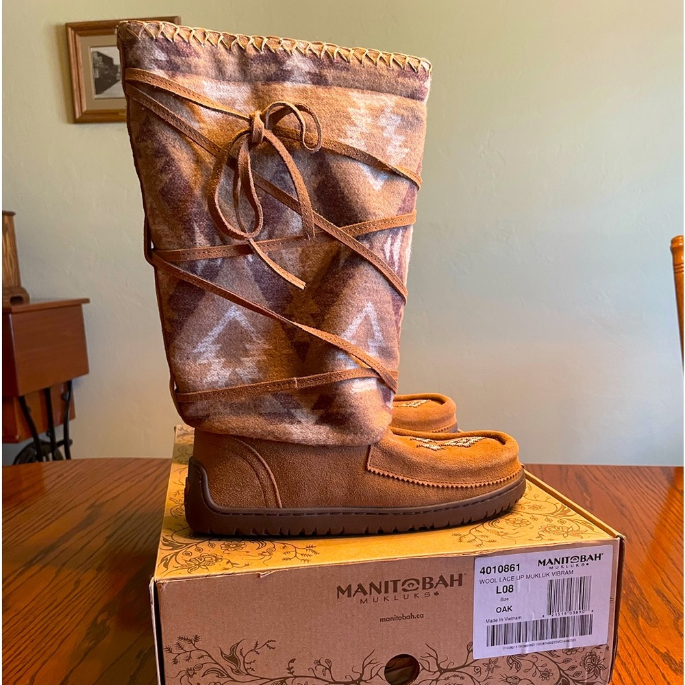 Brand new, never worn wool lace up Manitobah mukluks. Comes in original box.